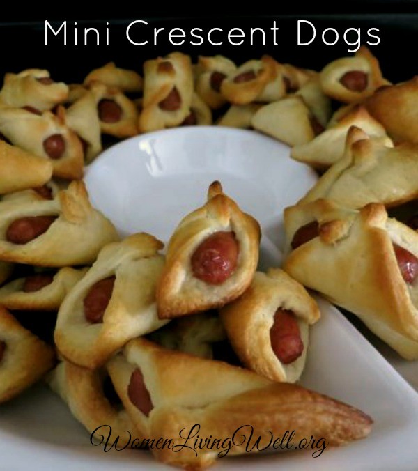 These Mini-Crescent Dogs are so easy to make. With only two ingredients, you can whip up these perfect finger foods so quickly you wont believe it!  #womenLivingWell #easyrecipe #snacks
