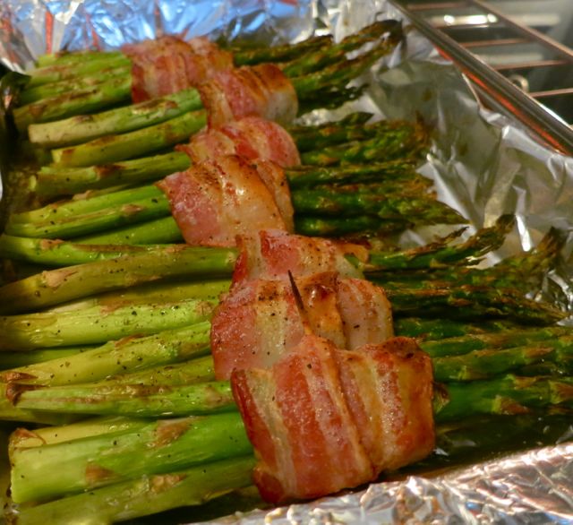 Whether you bake these asparagus in the oven or put them on the grill, they are sure to be an instant favorite side dish; or serve them for a light dinner. #WomenLivingWell #asparagus #bacon #grill